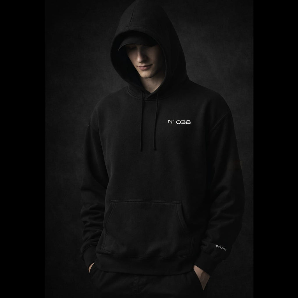 Person wearing a black hoodie with 'N°38' logo on a dark background