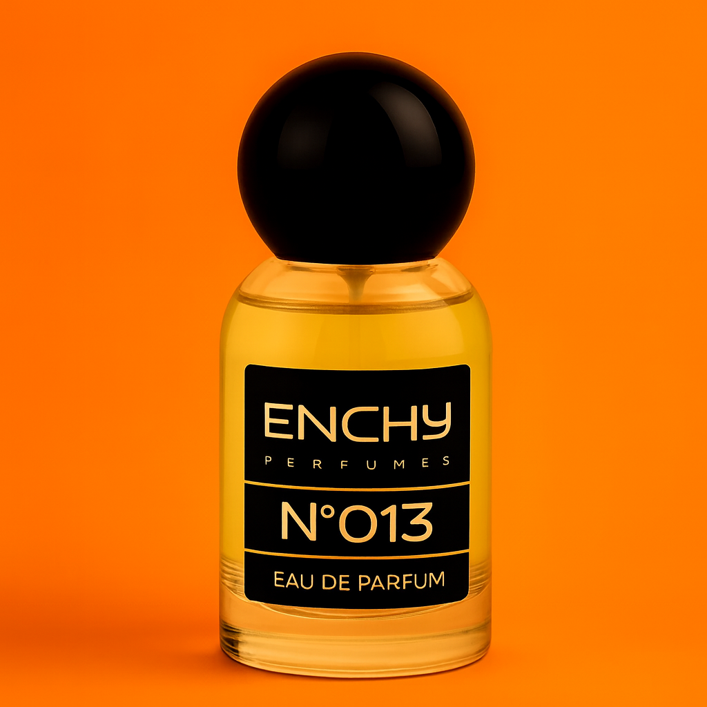 Enchy perfume bottle with black cap on an orange background